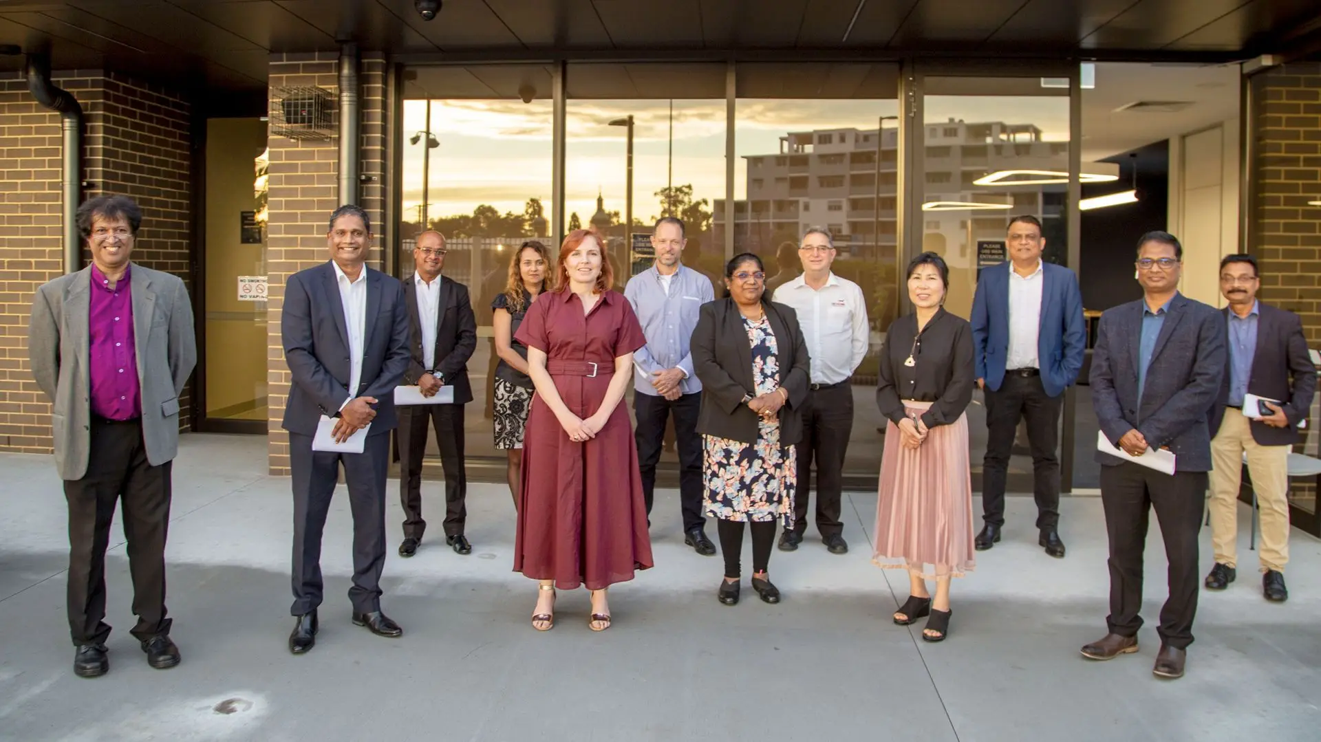 Chamber members and community leaders outside a local venue